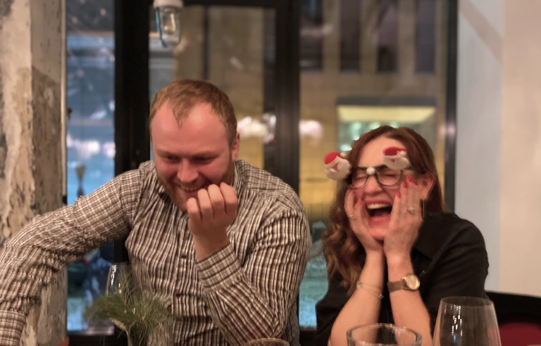 JetOctopus team members laughing together at dinner